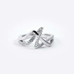 Amare Diamond Ring featuring a unique loose knot design with intertwined diamond-pave and polished metal lines
