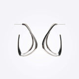 Sterling silver Amare Aura Set earrings with twisted loop design on white background