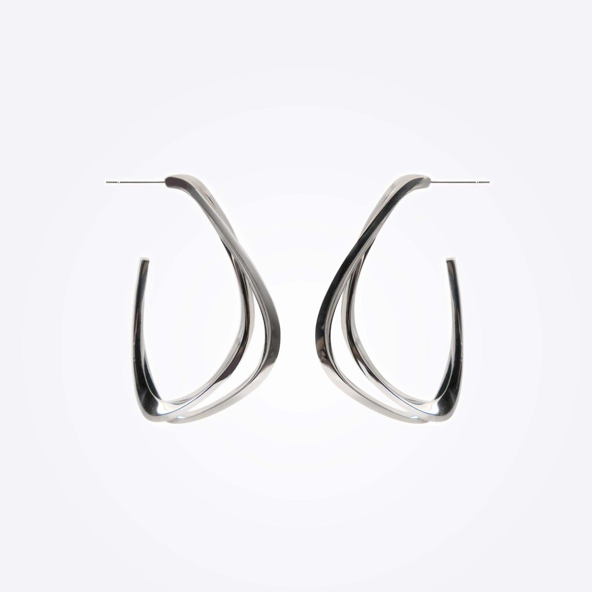 Sterling silver Amare Aura Set earrings with twisted loop design on white background