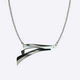 Sterling silver Cascade Pendant with asymmetrical, flowing twisted curves on a 17.75-inch chain
