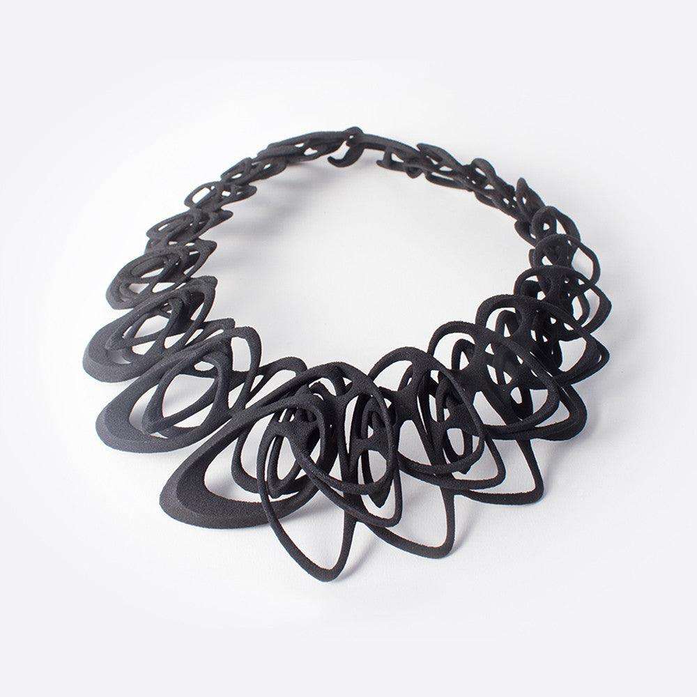 Black 3D printed Catena Necklace with interlocking elliptical petals made from flexible TPU polymer