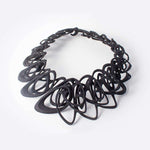 Black 3D printed Catena Necklace with interlocking elliptical petals made from flexible TPU polymer