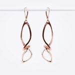 Centri Earrings in 18K rose gold vermeil with long loose knot design and elegant precision edge detailing