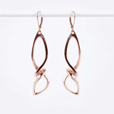 Centri Earrings in 18K rose gold vermeil with long loose knot design and elegant precision edge detailing