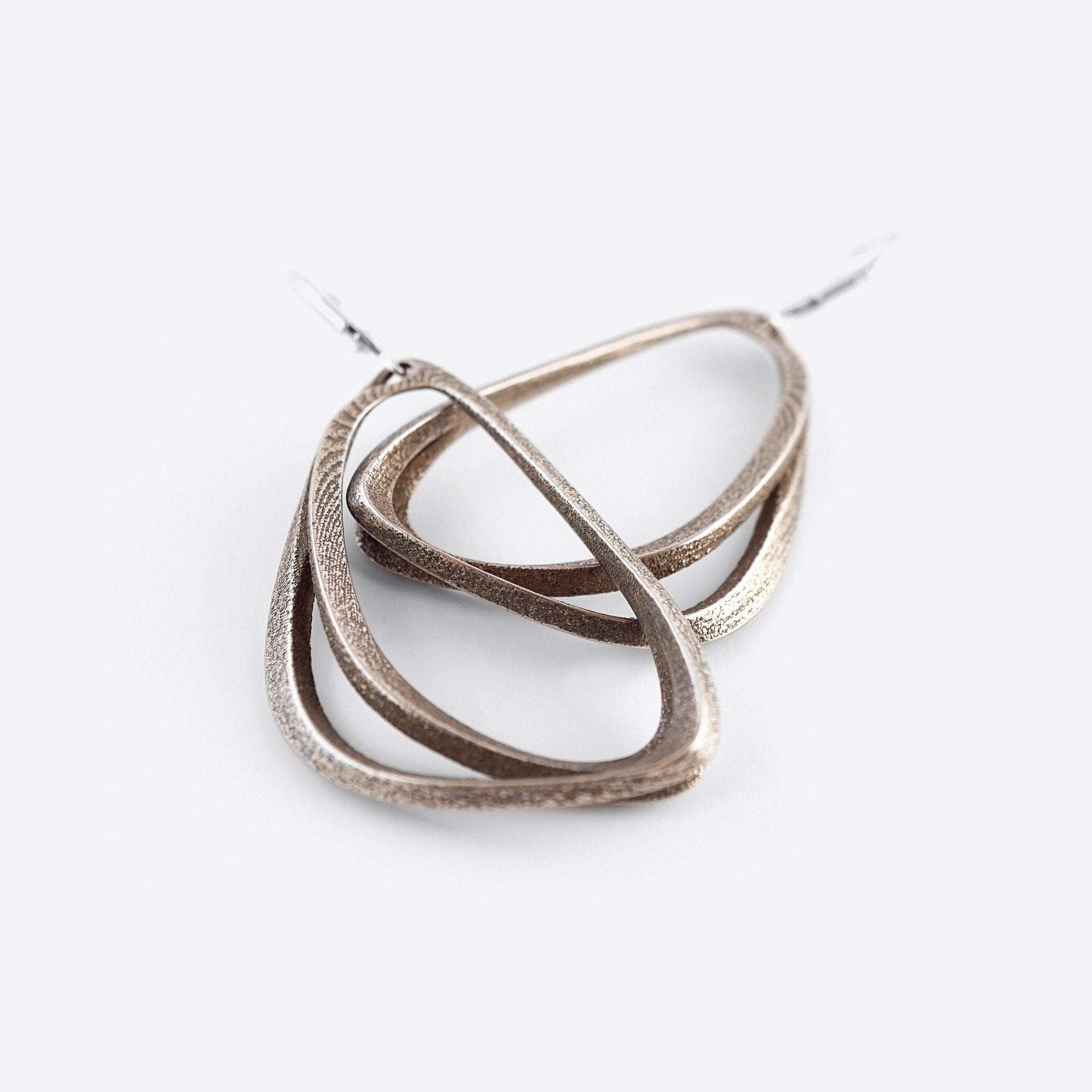 Aura Steel stainless steel earrings with misaligned angled loops for everyday wear