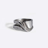 Velum Stainless Steel Ring with drapery-inspired curved design and open back in stainless steel 316