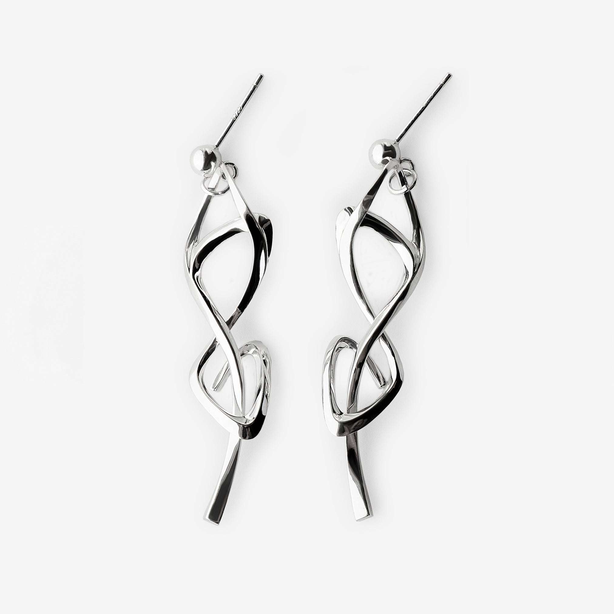Silver Nova earrings with elegant twisted knot design and high-precision edge detailing
