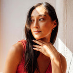 Woman wearing Hydra Diamond Ring on finger with natural light and soft shadows