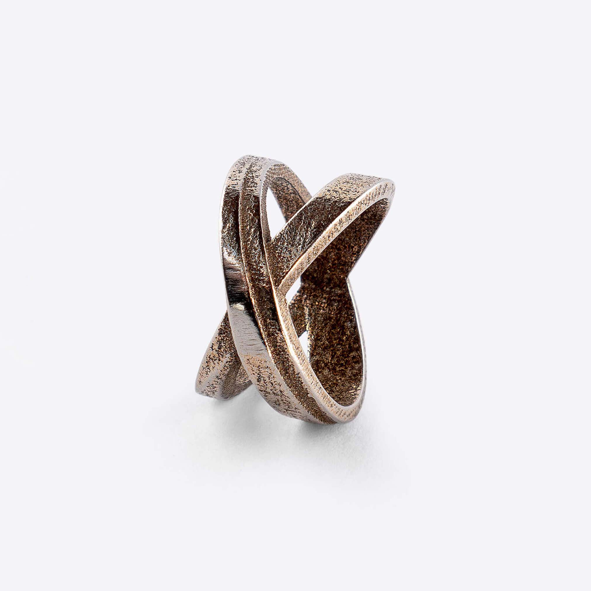 X Steel Ring with crossing tapering lines and precision edge detailing in stainless steel bronze finish