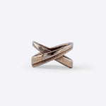X Steel Ring with crossing tapering lines and precision edge detailing in bronze finish