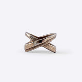 X Steel Ring with crossing tapering lines and precision edge detailing in bronze finish