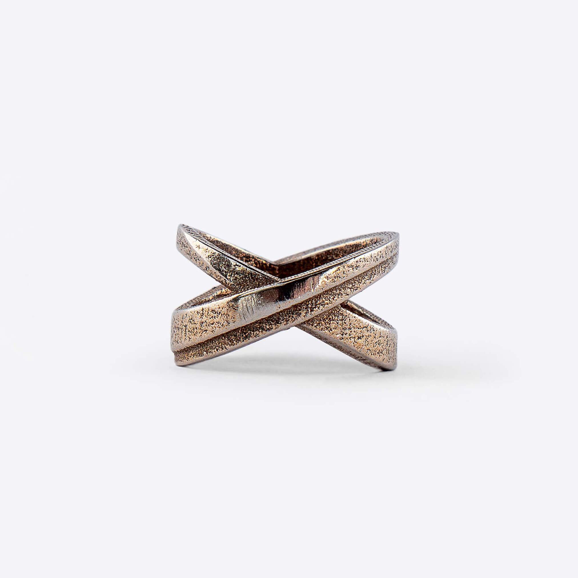 X Steel Ring with crossing tapering lines and precision edge detailing in bronze finish