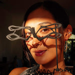 LACE's exquisite 3D-printed gray nylon masquerade mask with intricate linework and precision edge detailing worn by woman