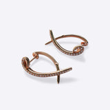 Rose gold Hydra diamond earrings with 0.11ct sparkling diamonds in a modern twisted huggie design