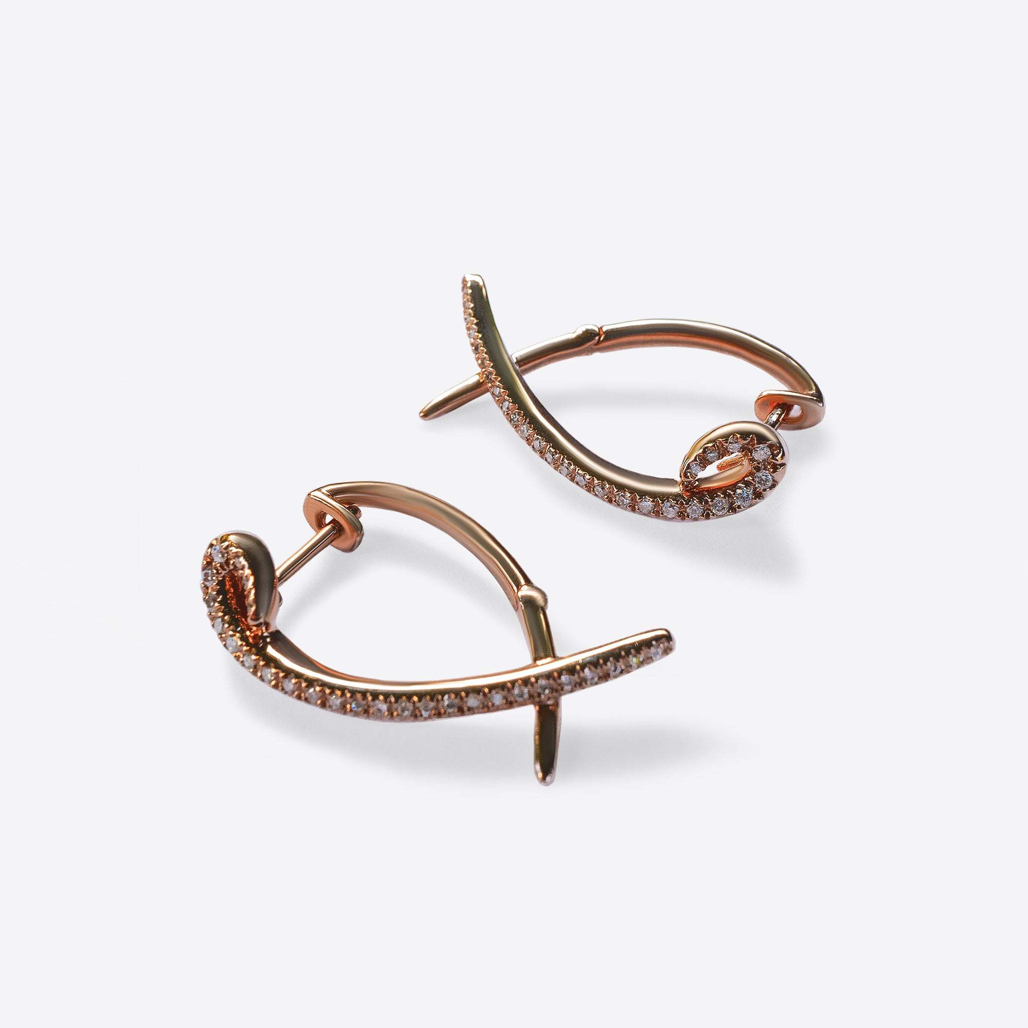 Rose gold Hydra diamond earrings with 0.11ct sparkling diamonds in a modern twisted huggie design