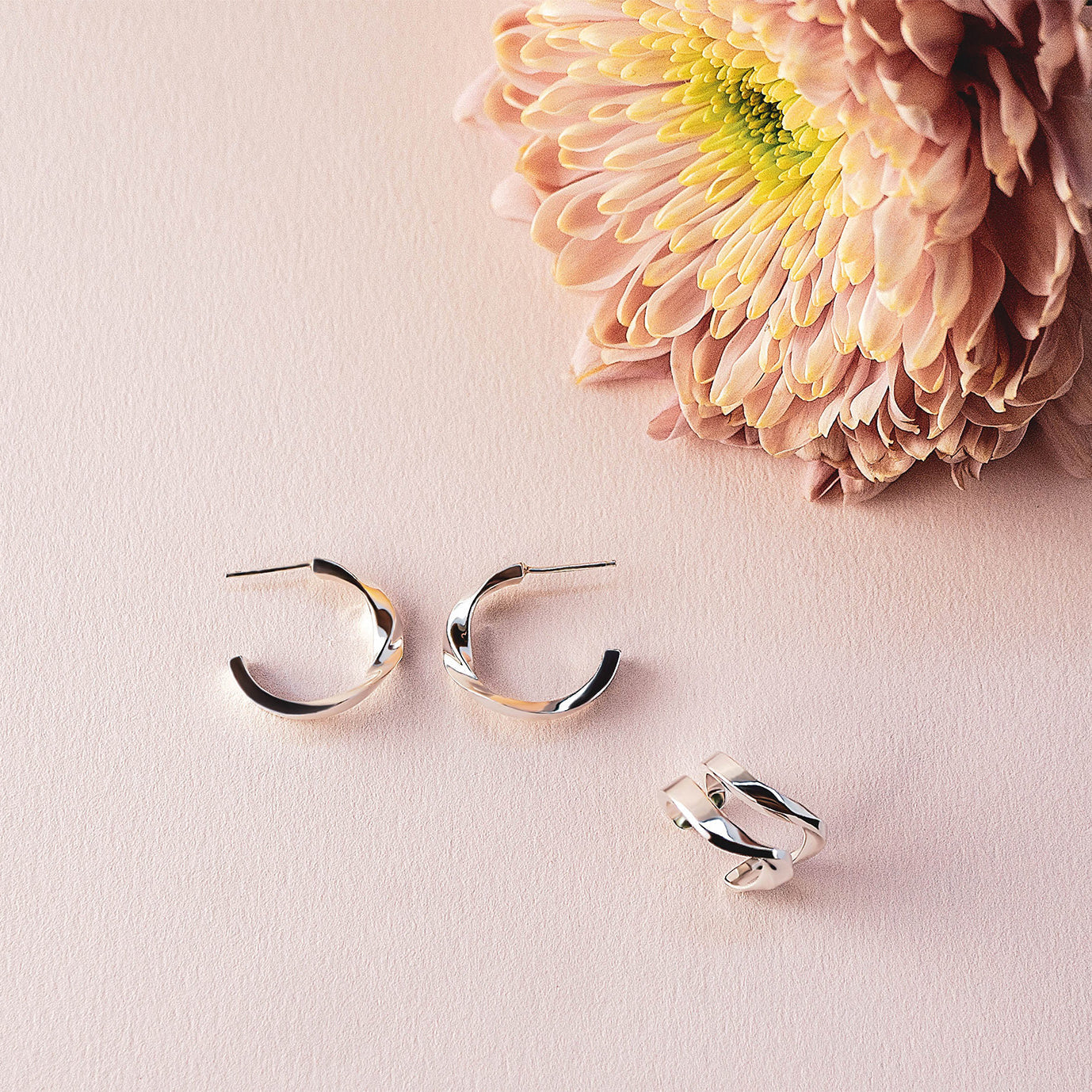 Linea Earrings Set sterling silver mini hoops and ear cuff with pink flower on light background