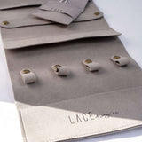 Gray LACE Travel Jewelry Roll organizer with compartments and snap closures for rings and earrings