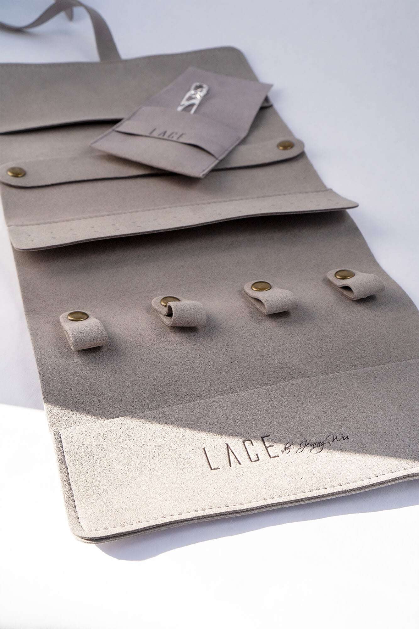 Gray LACE Travel Jewelry Roll organizer with compartments and snap closures for rings and earrings