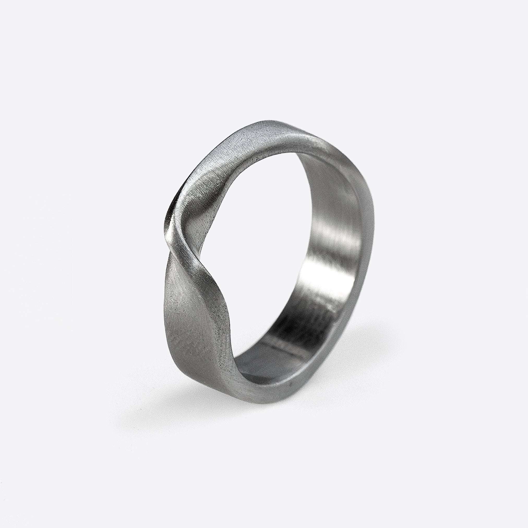 Amor Stainless Steel Ring with twisted band and precision edge detailing in brushed finish