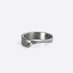 Amor stainless steel ring with clean line design and twisting band detail on white background