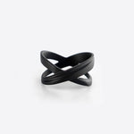Black X Steel Ring with crossing tapering lines and precision edge detailing