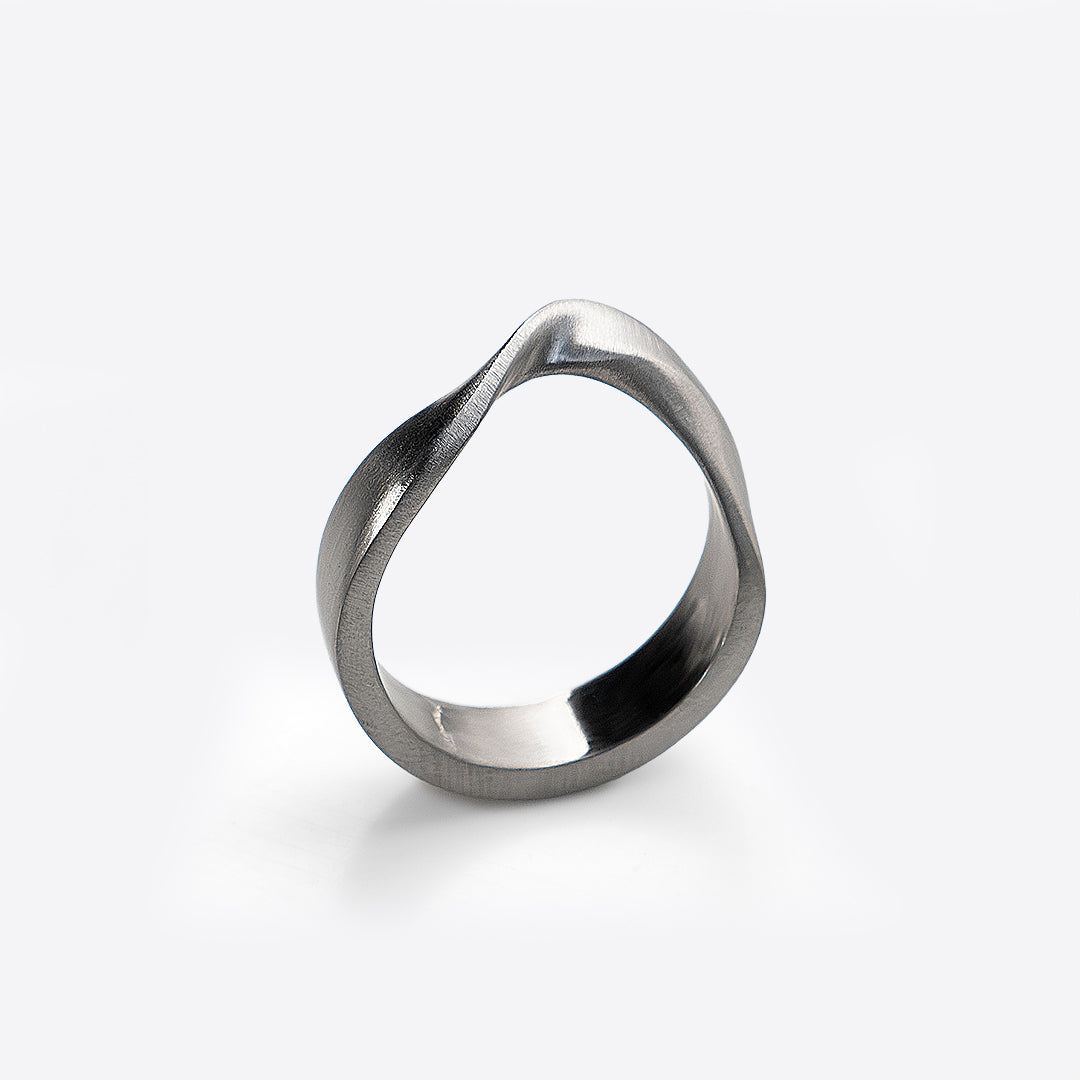 Amos Stainless Steel Ring with twisting band and precision edge detailing
