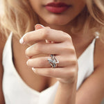 Woman wearing unique silver engagement ring from engagement ring samples set