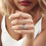Woman wearing unique silver engagement ring from engagement ring samples set
