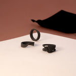 Men's ring samples set with three nylon ring designs on white and brown background with black velvet pouch