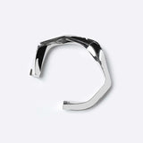 Oblique Cuff sterling silver bracelet with bold, sculptural design and intricate detailing.