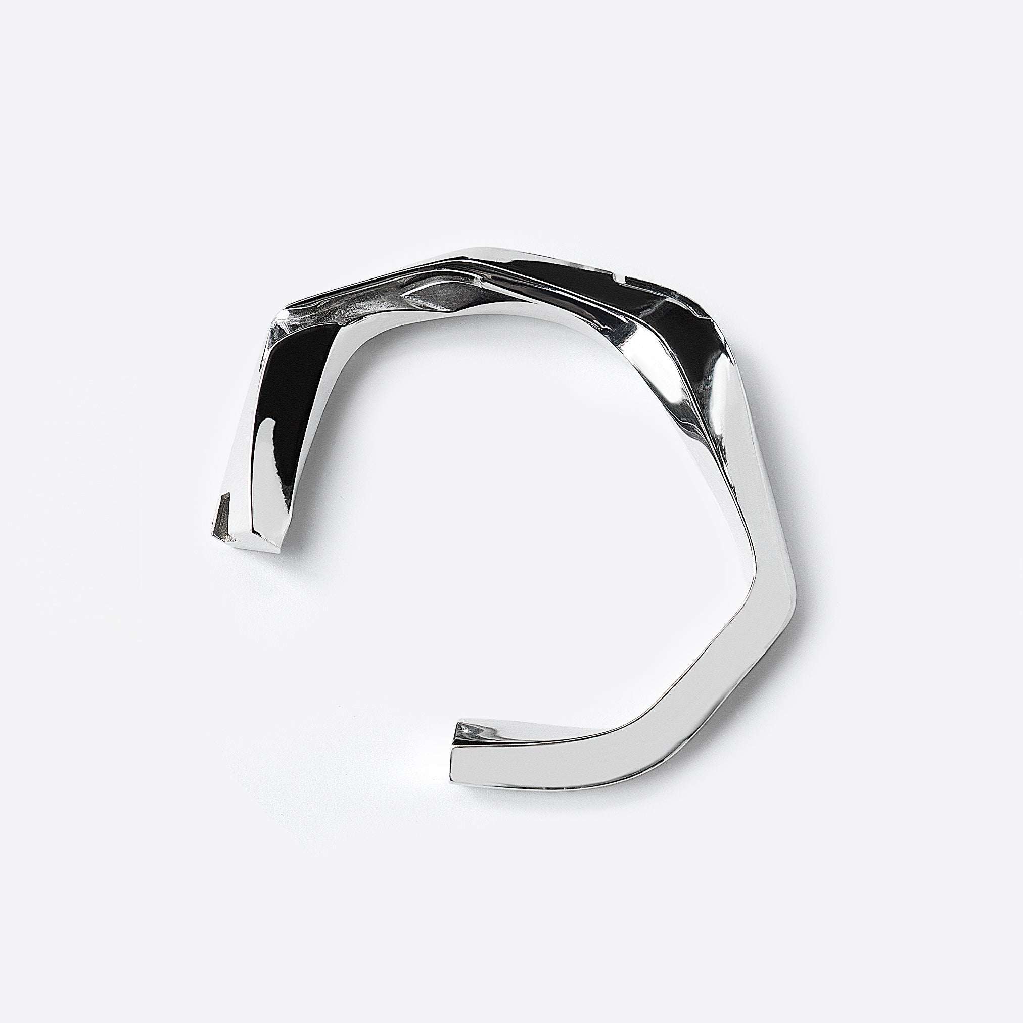 Oblique Cuff sterling silver bracelet with bold, sculptural design and intricate detailing.