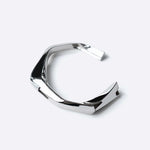 Oblique Cuff sterling silver bracelet with bold sculptural design and polished finish
