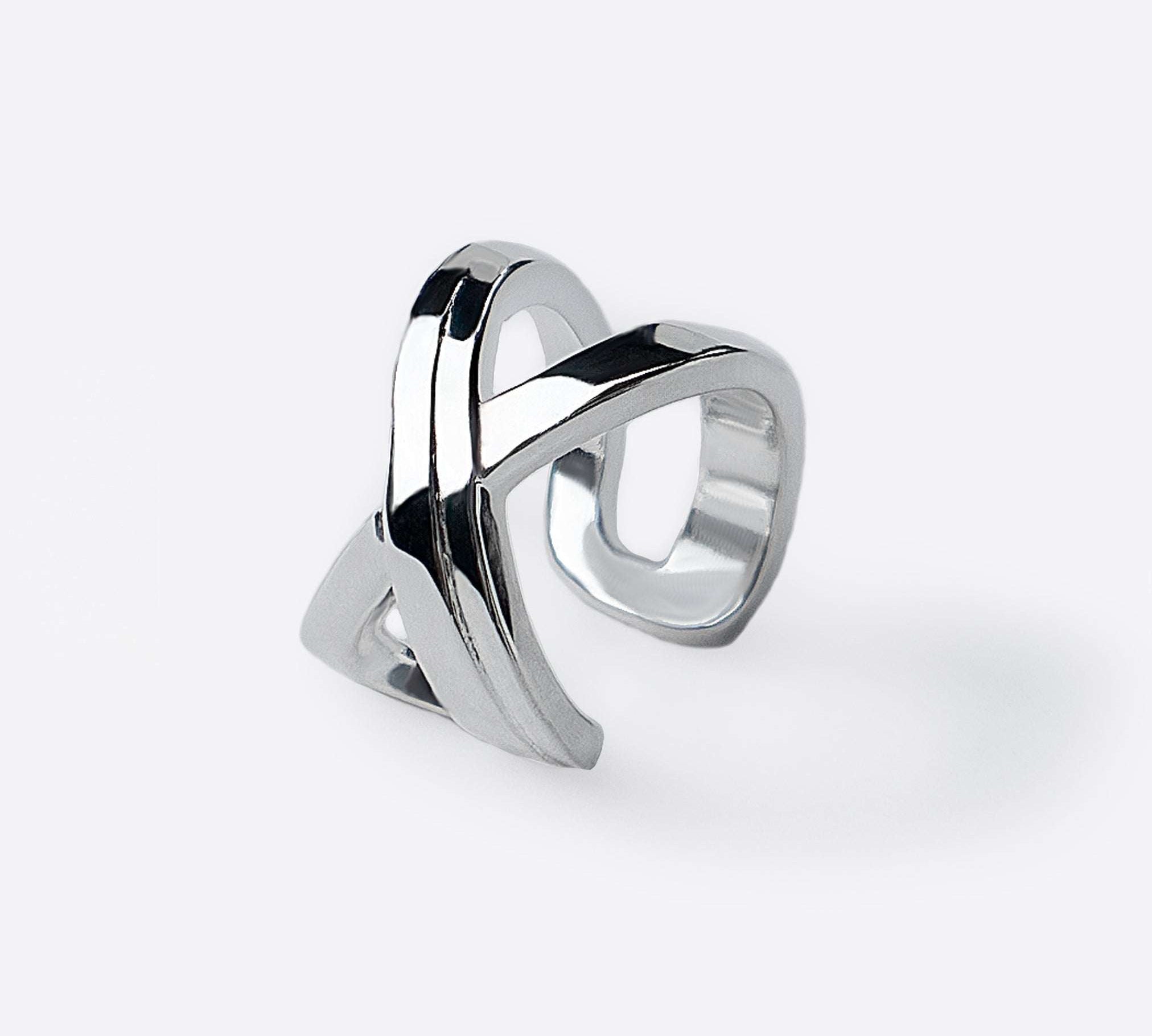 Sterling silver X Ear Cuff with two sculpted tapering lines crossing at front, modern elegant design.