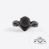 Close-up of a black nylon engagement ring sample from the Engagement Ring Samples Set showing detailed design and shape with an inset of the matching silver designer ring with diamond.