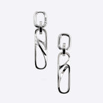 Sterling silver dangle earrings with three connected twisted square links, modern elegant design