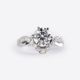 Close-up of a diamond engagement ring sample from the Engagement Ring Samples Set with a twisted band studded with small diamonds