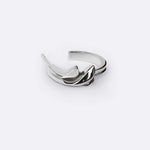 Calyx Mini Hoop silver earring with delicate layered petal design on white background