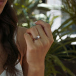 Iris Diamond Ring with 0.5 carat round diamond and intricate drapery design on hand