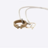 Machina L necklace stainless steel 24-inch Rolo chain with two rings on white background