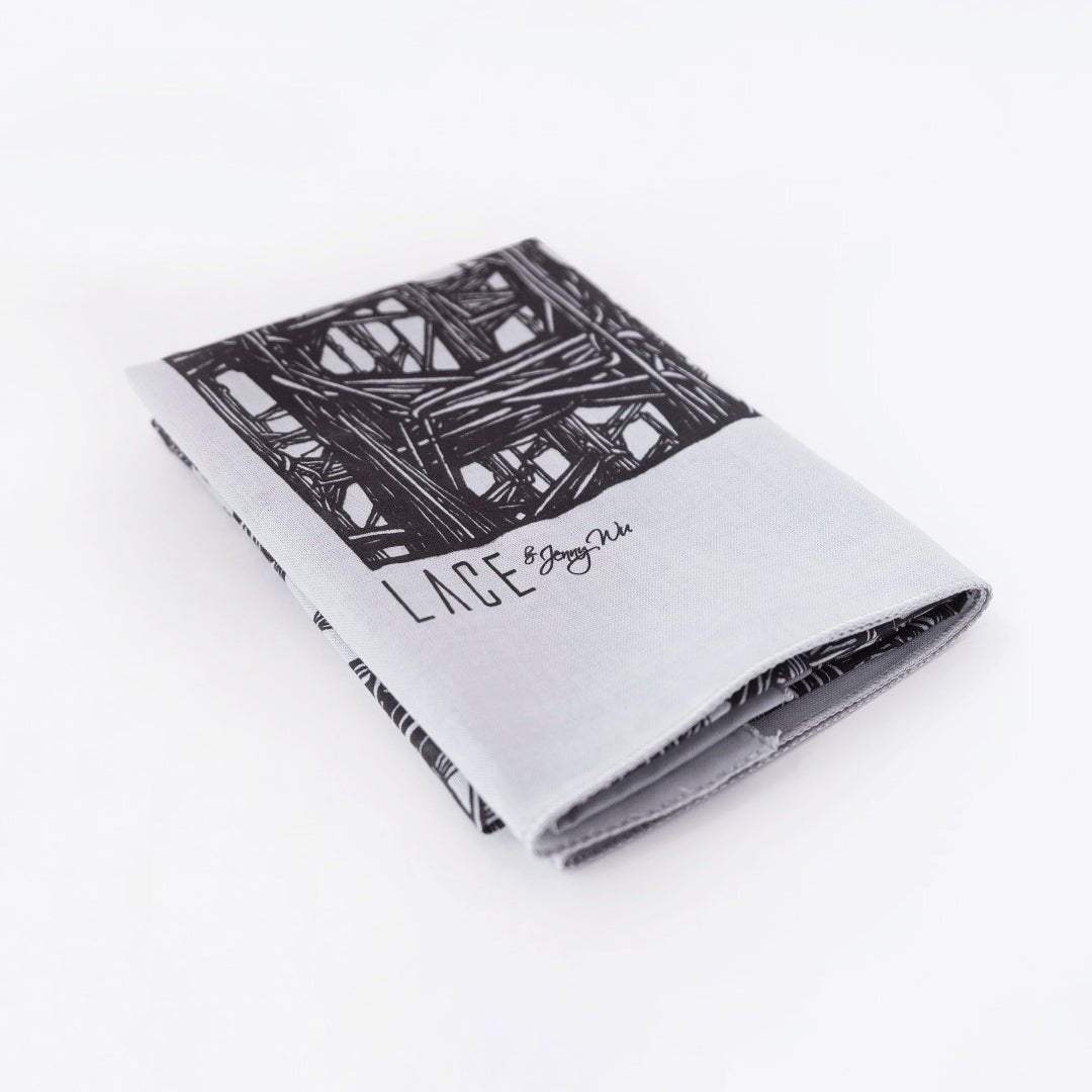 Folded Lineworks Bandana with black signature hand drawing on white premium cotton