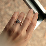 Sterling silver Adagio Velum Set ring with rippling curves on hand