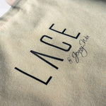 Close-up of beige LACE Tote Bag made from 100% cotton canvas with printed logo