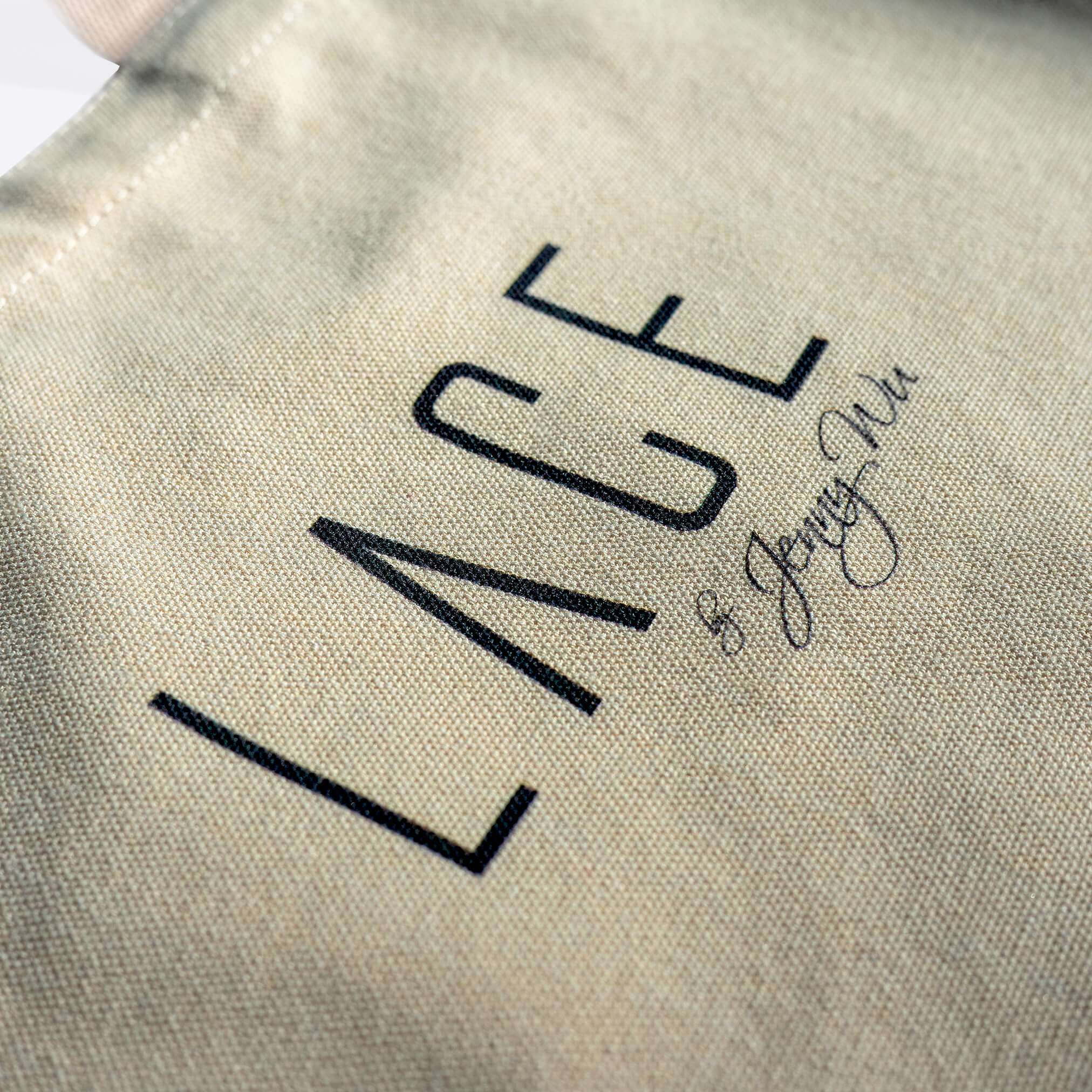 Close-up of beige LACE Tote Bag made from 100% cotton canvas with printed logo