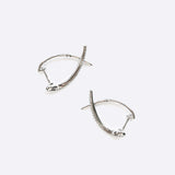 Hydra diamond earrings in 14K white gold with 0.11ct round brilliant diamonds in a modern looped huggie design