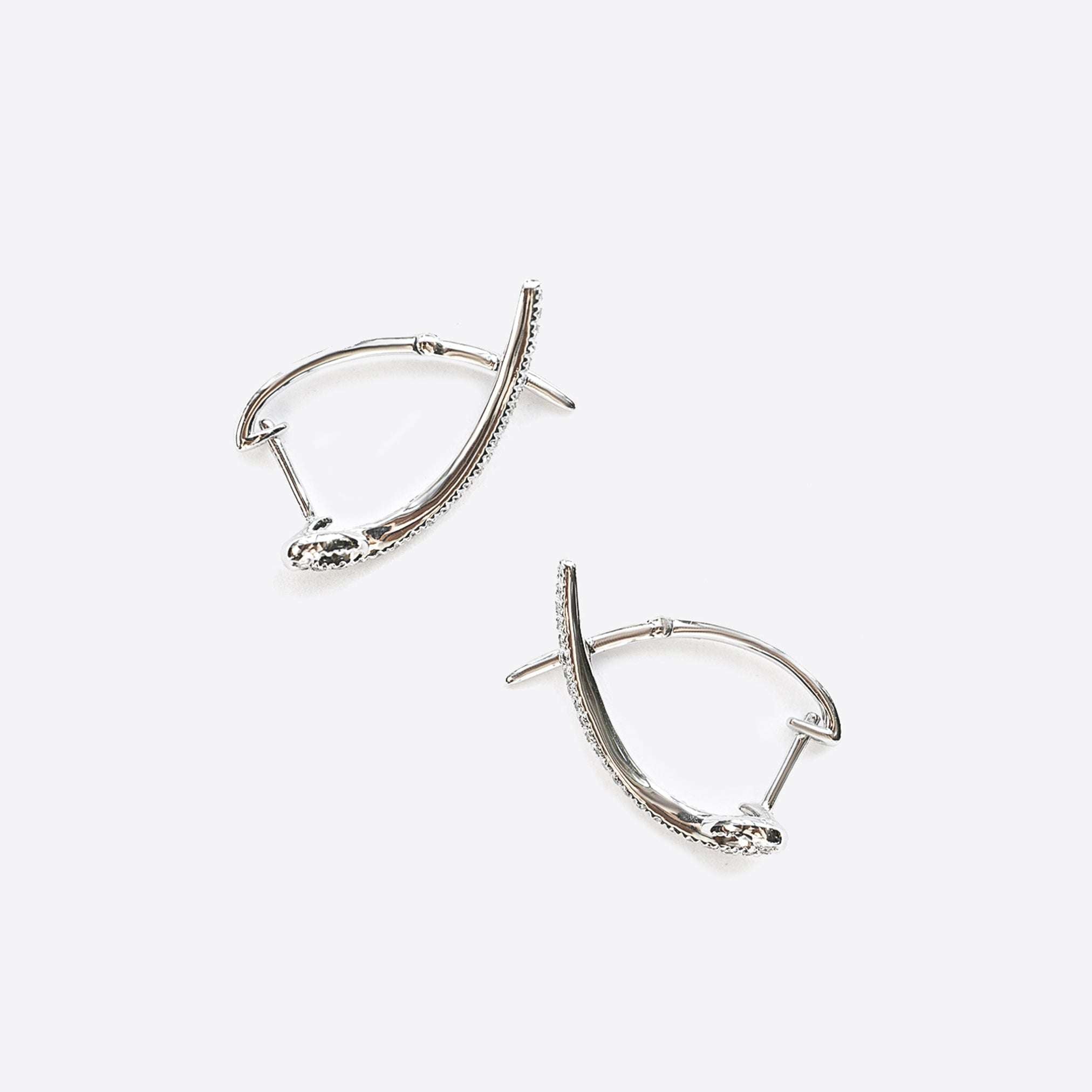 Hydra diamond earrings in 14K white gold with 0.11ct round brilliant diamonds in a modern looped huggie design