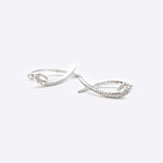 Hydra diamond earrings in 14K white gold with 0.11ct sparkling diamonds in a looped huggie design