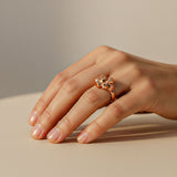 Rose gold Hexa Rings Set with hexagonal design worn on finger, featuring two nested rings forming a statement piece