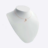 14K rose gold initials pendant necklace on white display bust