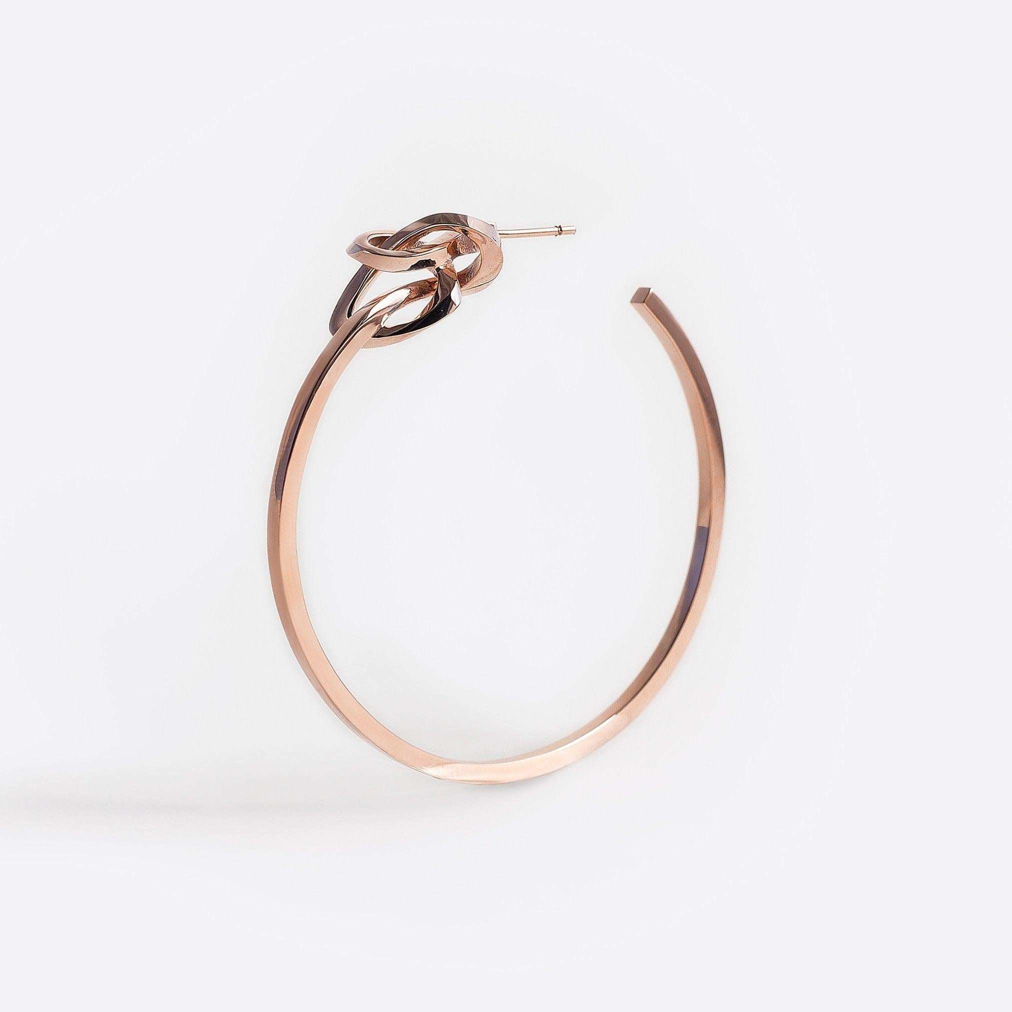 Rose gold vermeil Coda hoop earring with a loose knot detail and precision edges.