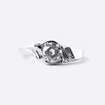 Close-up of Iris Diamond Ring featuring a 0.5 carat round lab-grown diamond with drapery-inspired silver band design